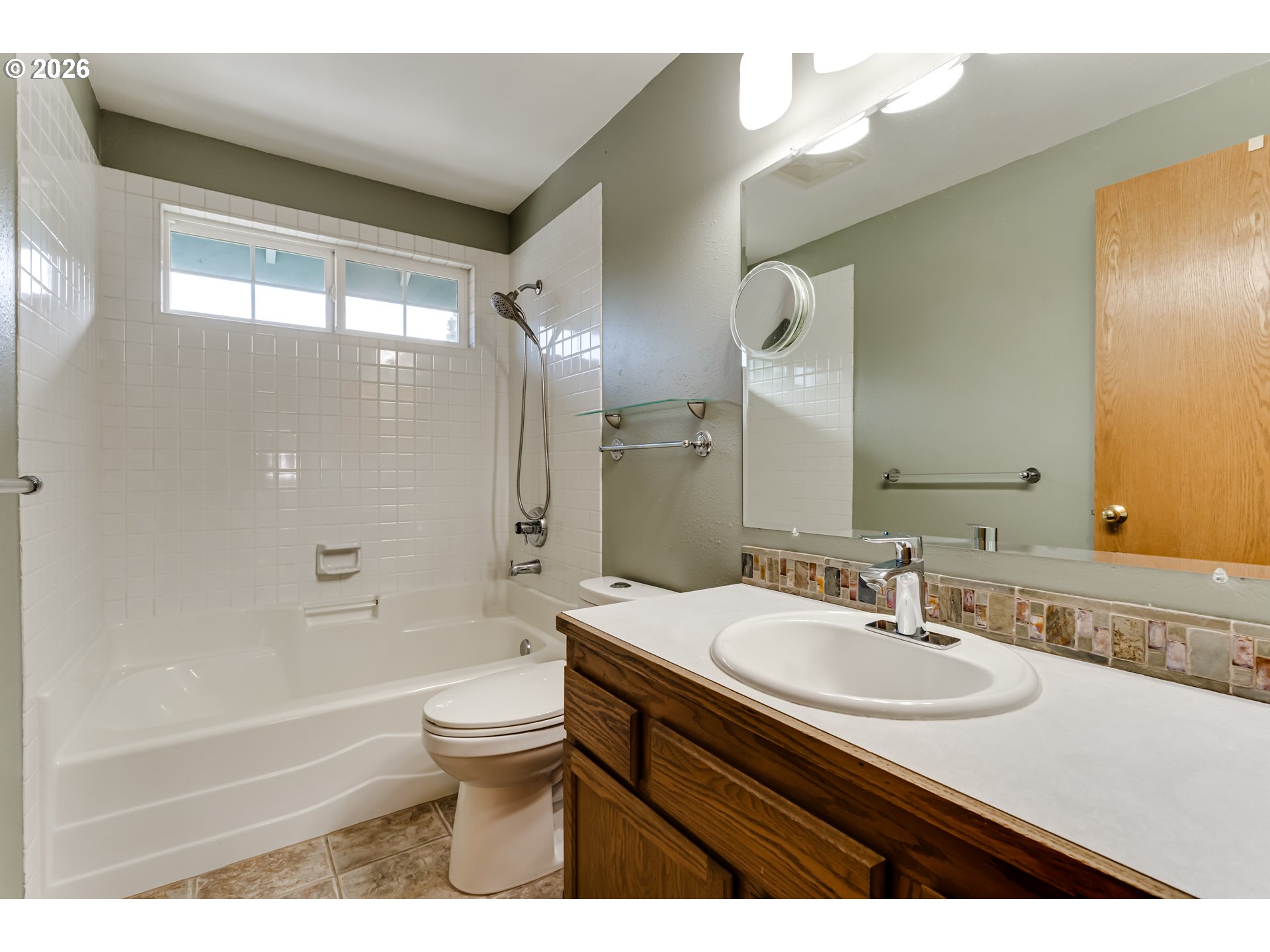 5131 Trevon Street Eugene, OR 97402 - Photo 24 of 42 a bathroom with a sink a toilet and a large mirror