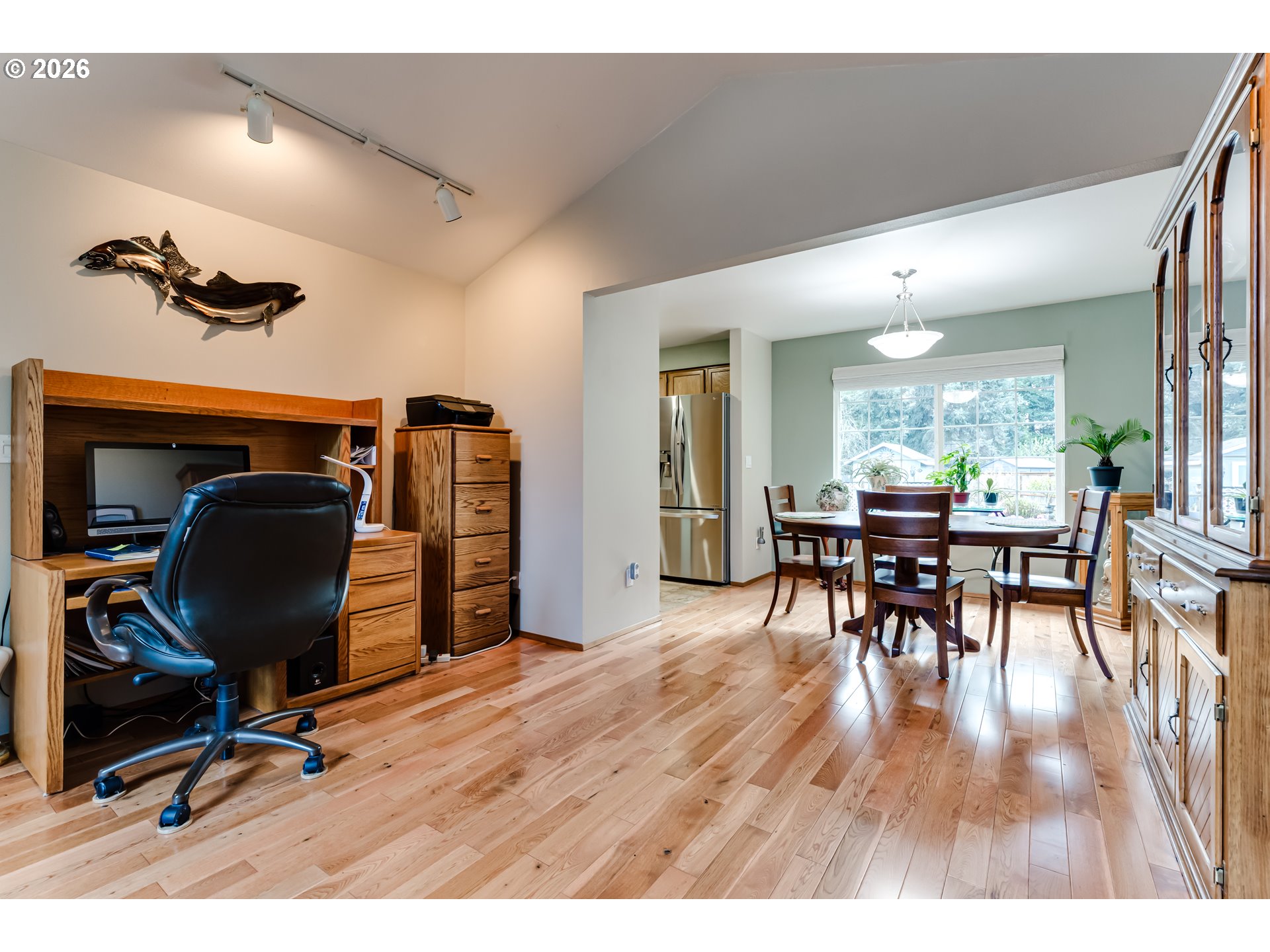 5131 Trevon Street Eugene, OR 97402 - Photo 7 of 42 a workspace with furniture a rug and wooden floor