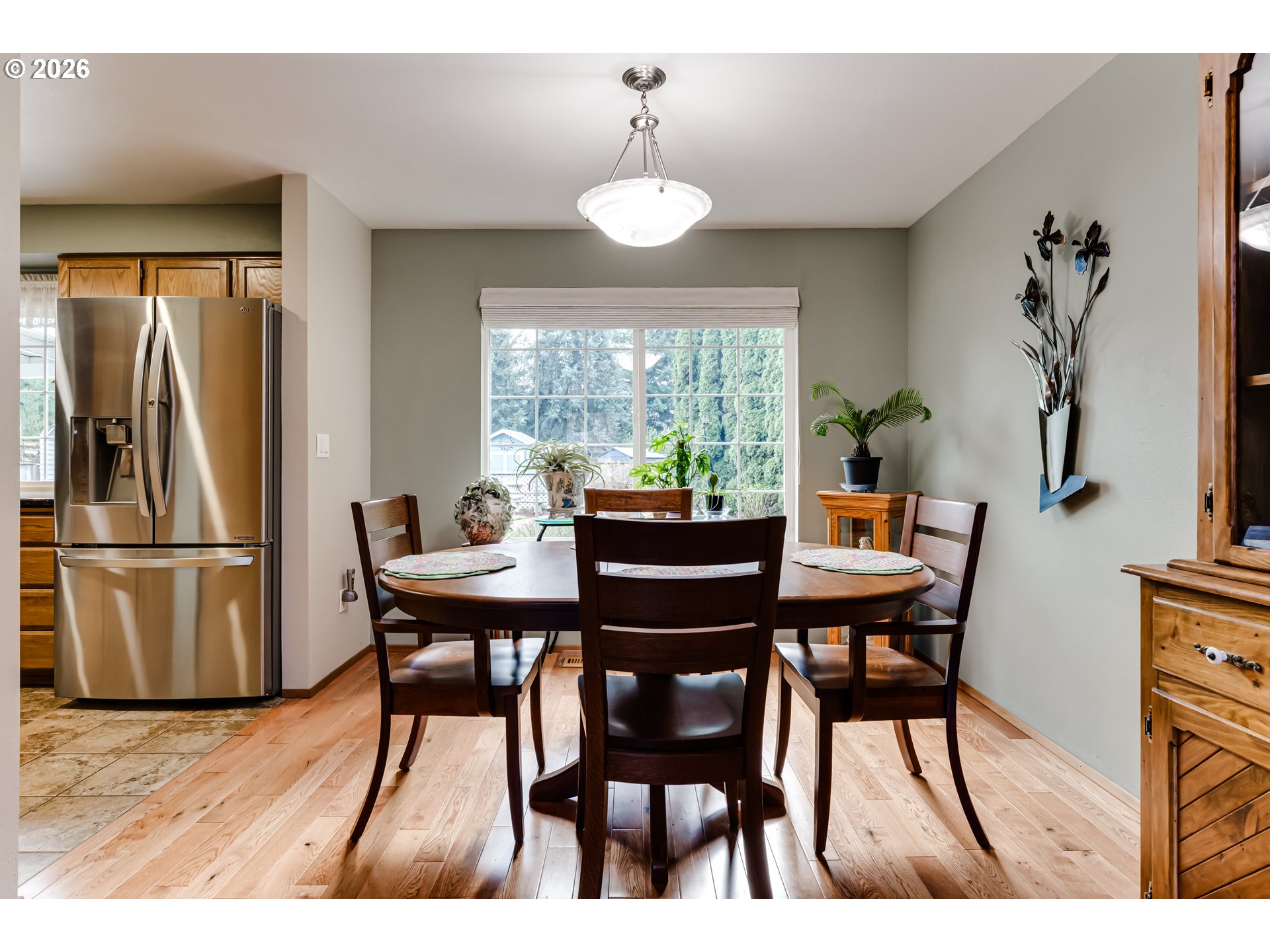 5131 Trevon Street Eugene, OR 97402 - Photo 8 of 42 a view of a dining room with furniture window and wooden floor