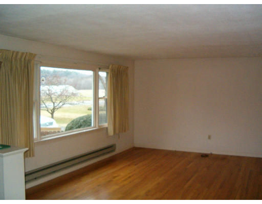 180 Plain Road Greenfield, MA 01301 - Photo 5 of 15 a view of an empty room and window
