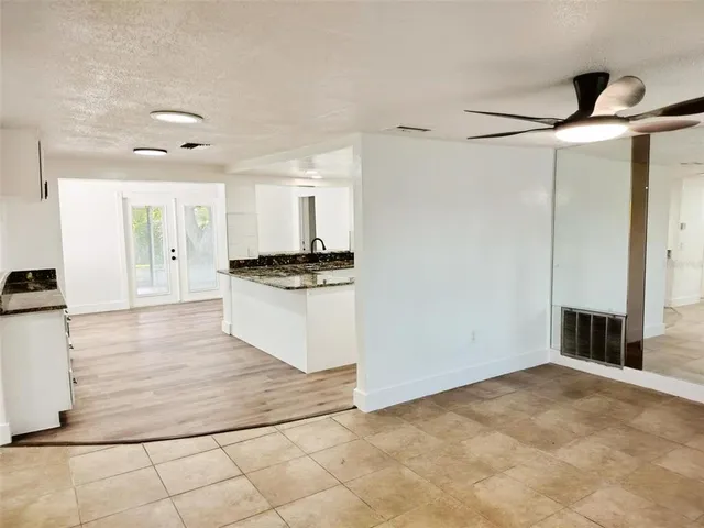 a view of a kitchen with electric appliances