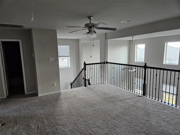 a view of a hallway with a chandelier
