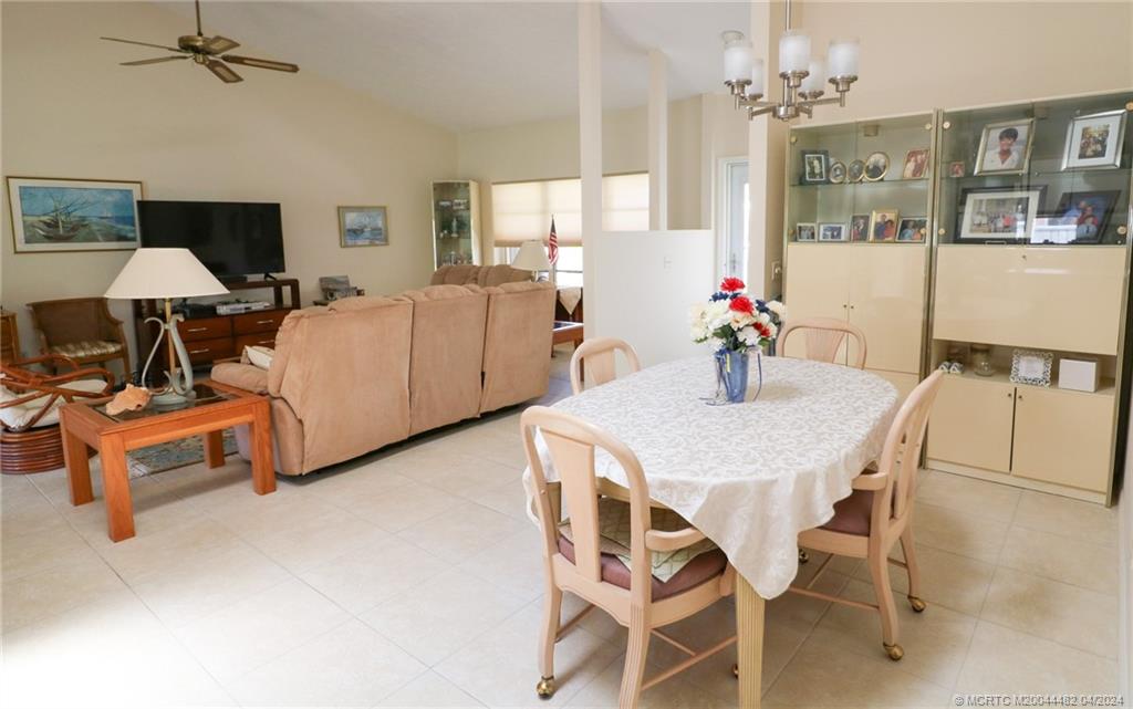 5139 Southeast Hanson Circle Stuart, FL 34997 - Photo 12 of 27 a view of a dining room with furniture and a chandelier