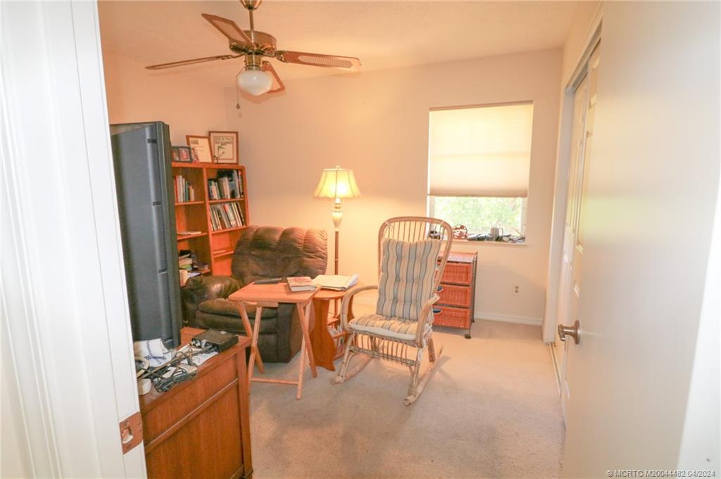 5139 Southeast Hanson Circle Stuart, FL 34997 - Photo 21 of 27 a view of a workspace with furniture and a window