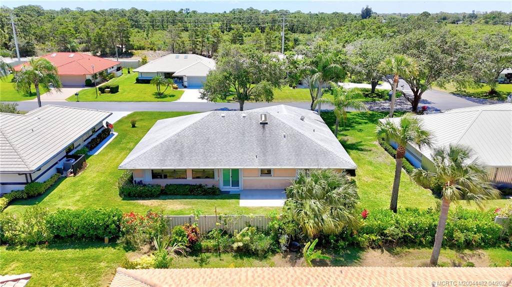 5139 Southeast Hanson Circle Stuart, FL 34997 - Photo 3 of 27 a aerial view of a house with swimming pool and mountains