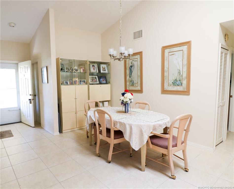 5139 Southeast Hanson Circle Stuart, FL 34997 - Photo 7 of 27 a view of a dining room with furniture