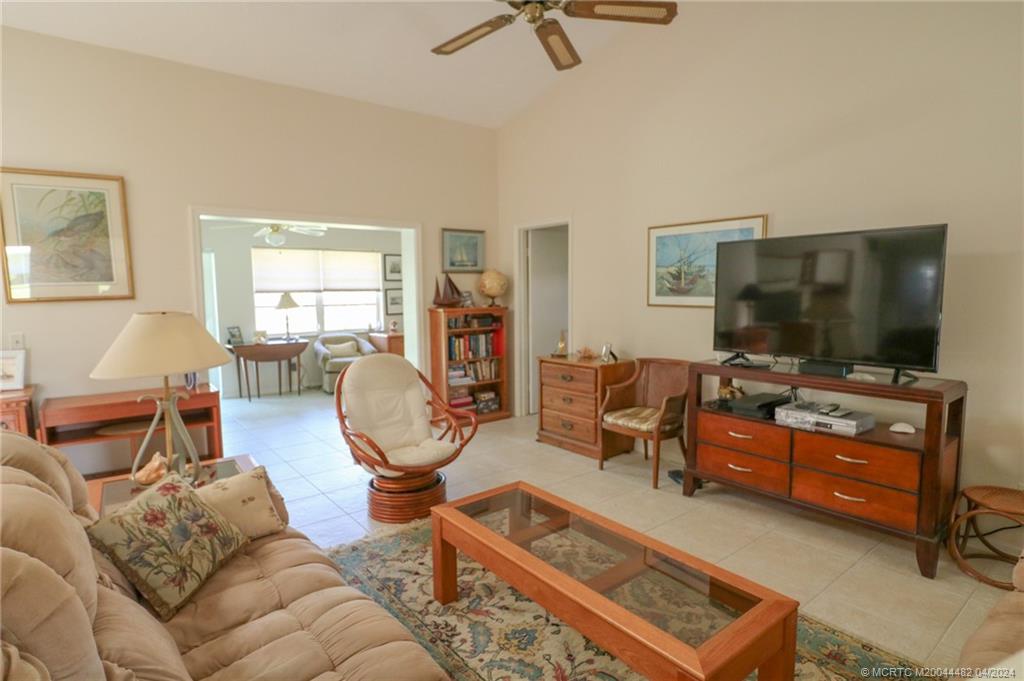 5139 Southeast Hanson Circle Stuart, FL 34997 - Photo 8 of 27 a living room with furniture and a flat screen tv