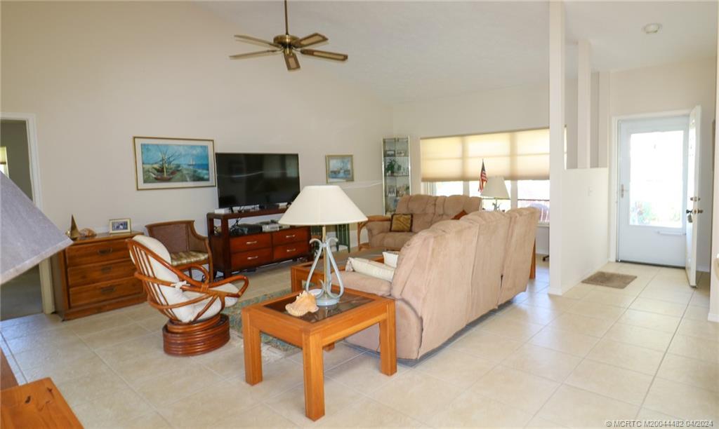 5139 Southeast Hanson Circle Stuart, FL 34997 - Photo 9 of 27 a living room with furniture and a flat screen tv