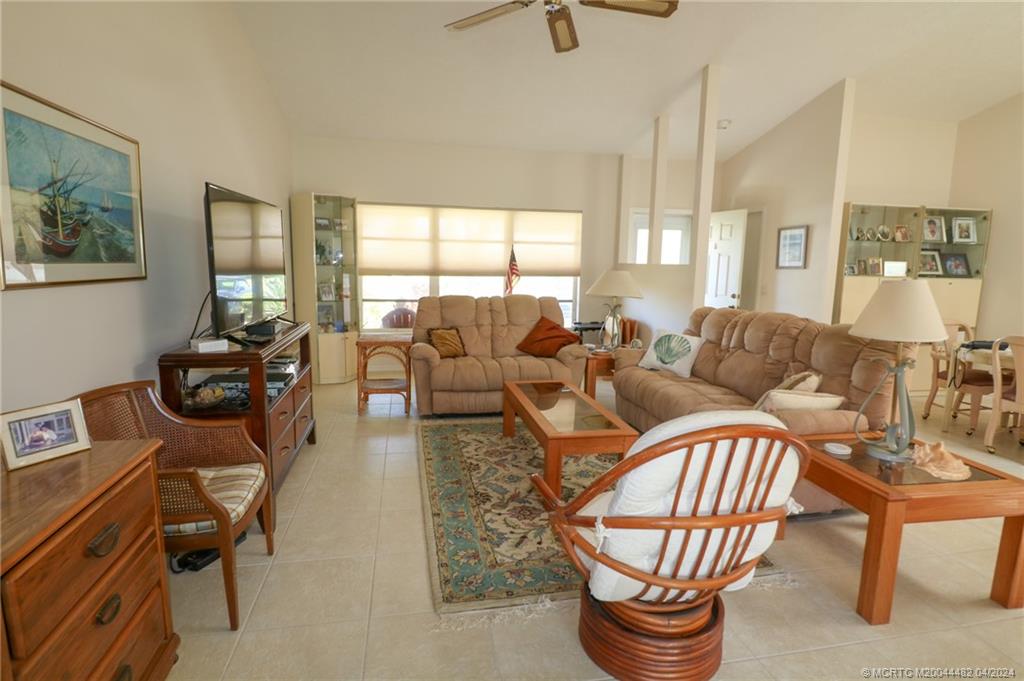 5139 Southeast Hanson Circle Stuart, FL 34997 - Photo 10 of 27 a living room with furniture and a large window