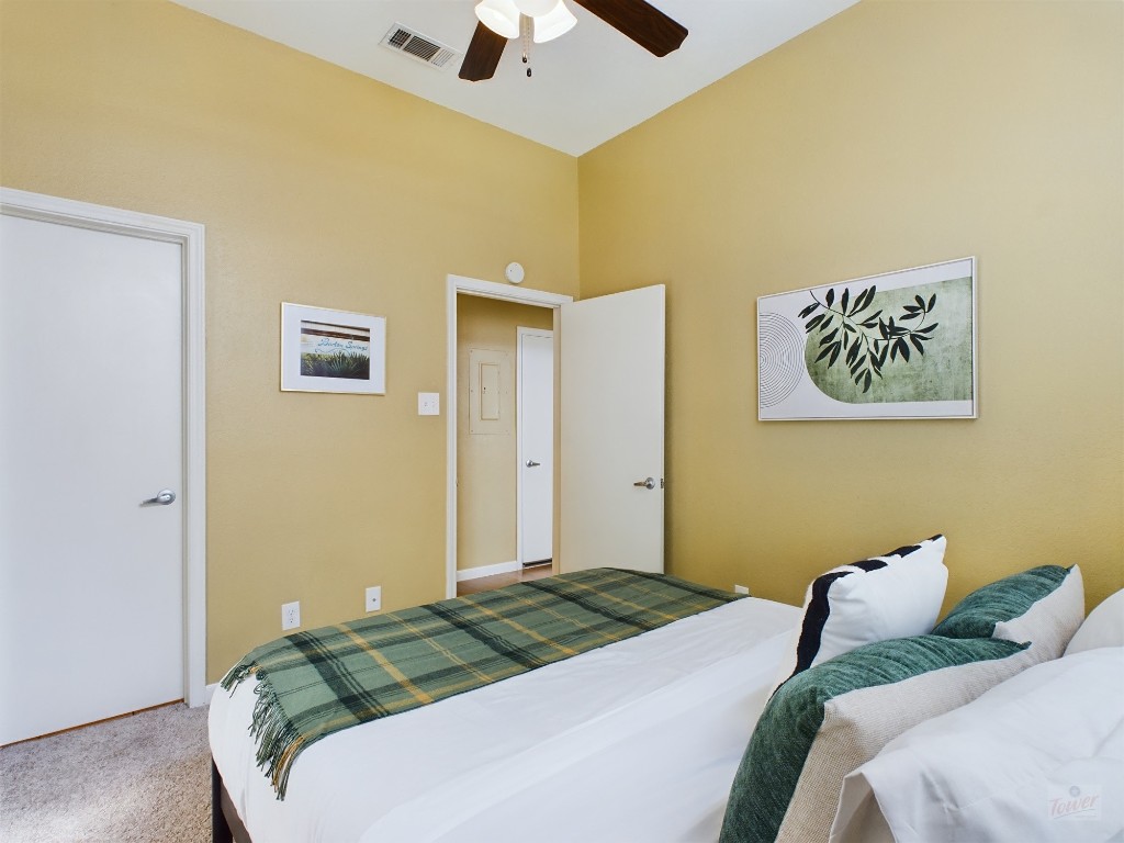 2811 Rio Grande Street, Unit 204 Austin, TX 78705 - Photo 17 of 31 a bedroom with a bed and a painting on the wall