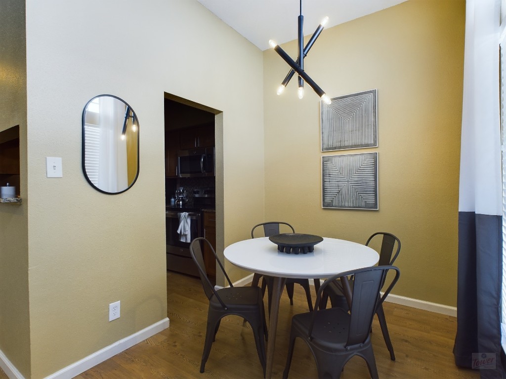 2811 Rio Grande Street, Unit 204 Austin, TX 78705 - Photo 2 of 31 a view of a dining room with furniture and a mirror