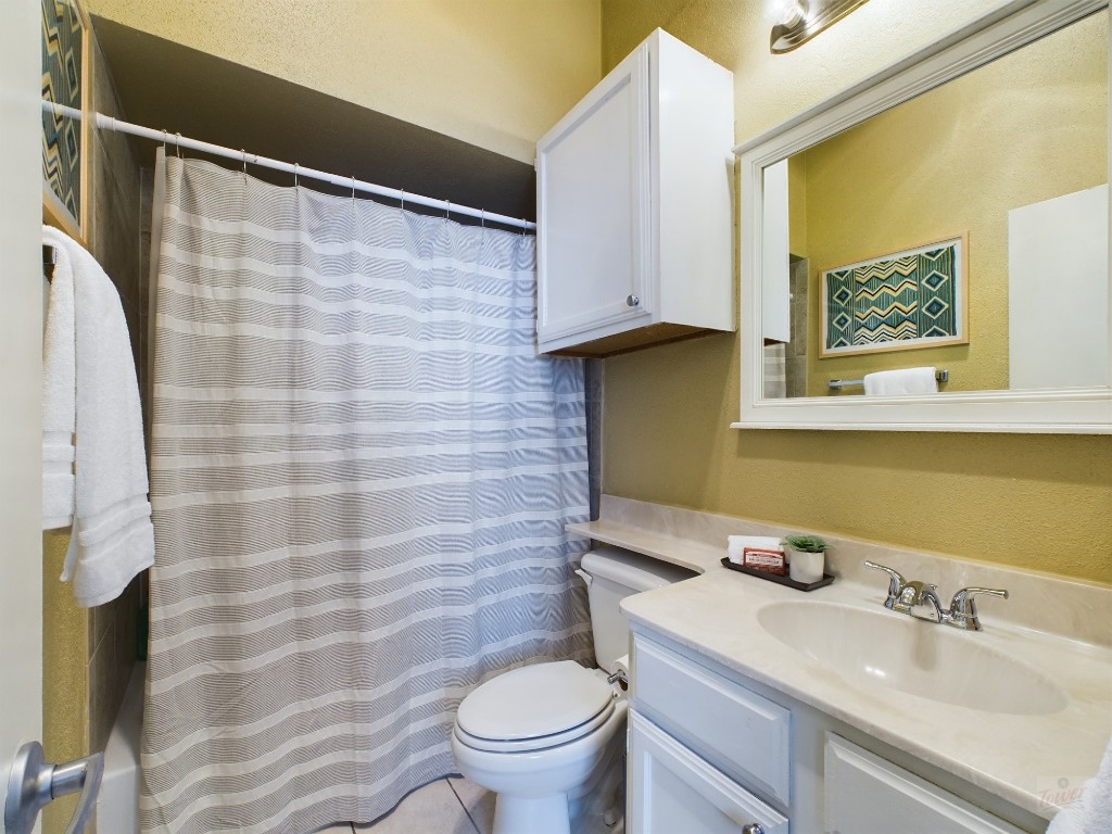 2811 Rio Grande Street, Unit 204 Austin, TX 78705 - Photo 25 of 31 a bathroom with a sink and a mirror