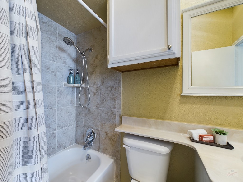2811 Rio Grande Street, Unit 204 Austin, TX 78705 - Photo 26 of 31 a bathroom with a bathtub sink and toilet