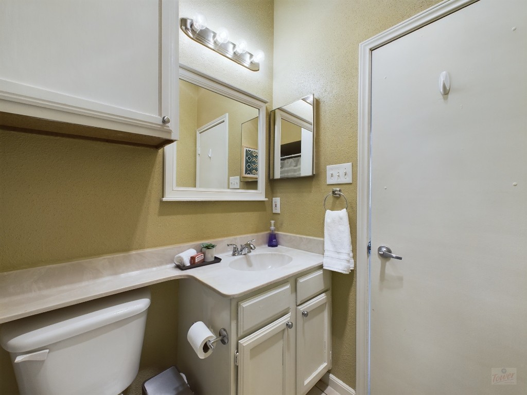 2811 Rio Grande Street, Unit 204 Austin, TX 78705 - Photo 27 of 31 a bathroom with a sink and a mirror