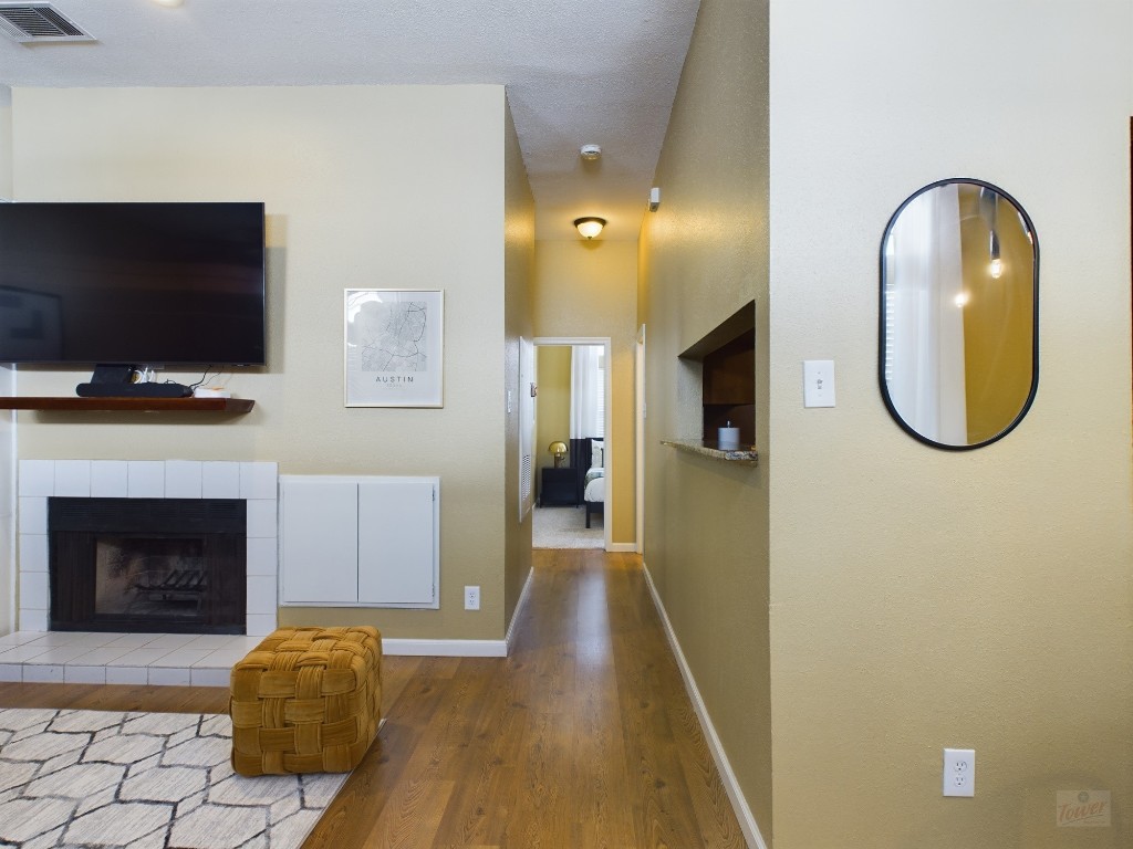 2811 Rio Grande Street, Unit 204 Austin, TX 78705 - Photo 6 of 31 a view of a livingroom with furniture fire place and flat screen tv