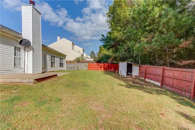 a house view with a backyard space