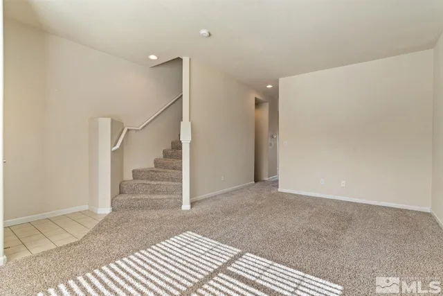 a view of entryway with wooden floor and stairs