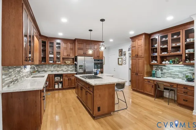 a kitchen with stainless steel appliances granite countertop a stove and a sink