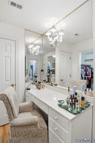 a living room with kitchen island furniture and a chandelier