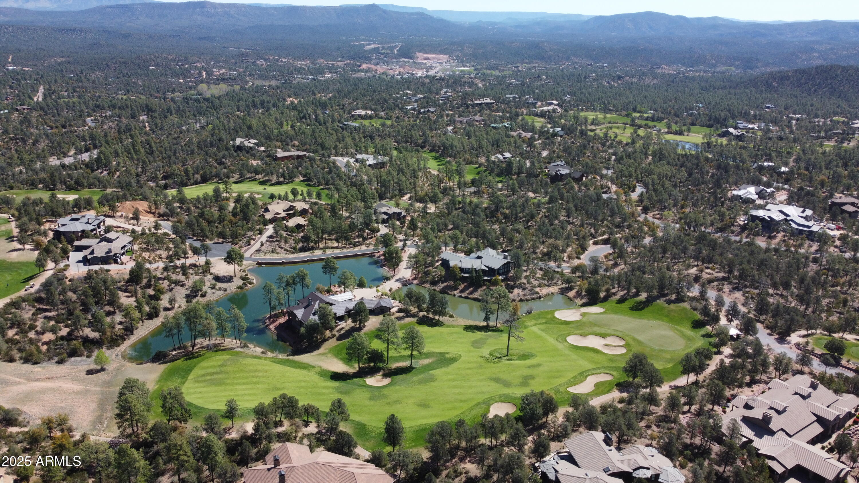 402 South Decision Pine, Unit 2 Payson, AZ 85541 - Photo 2 of 6 an aerial view of a golf course with parking space