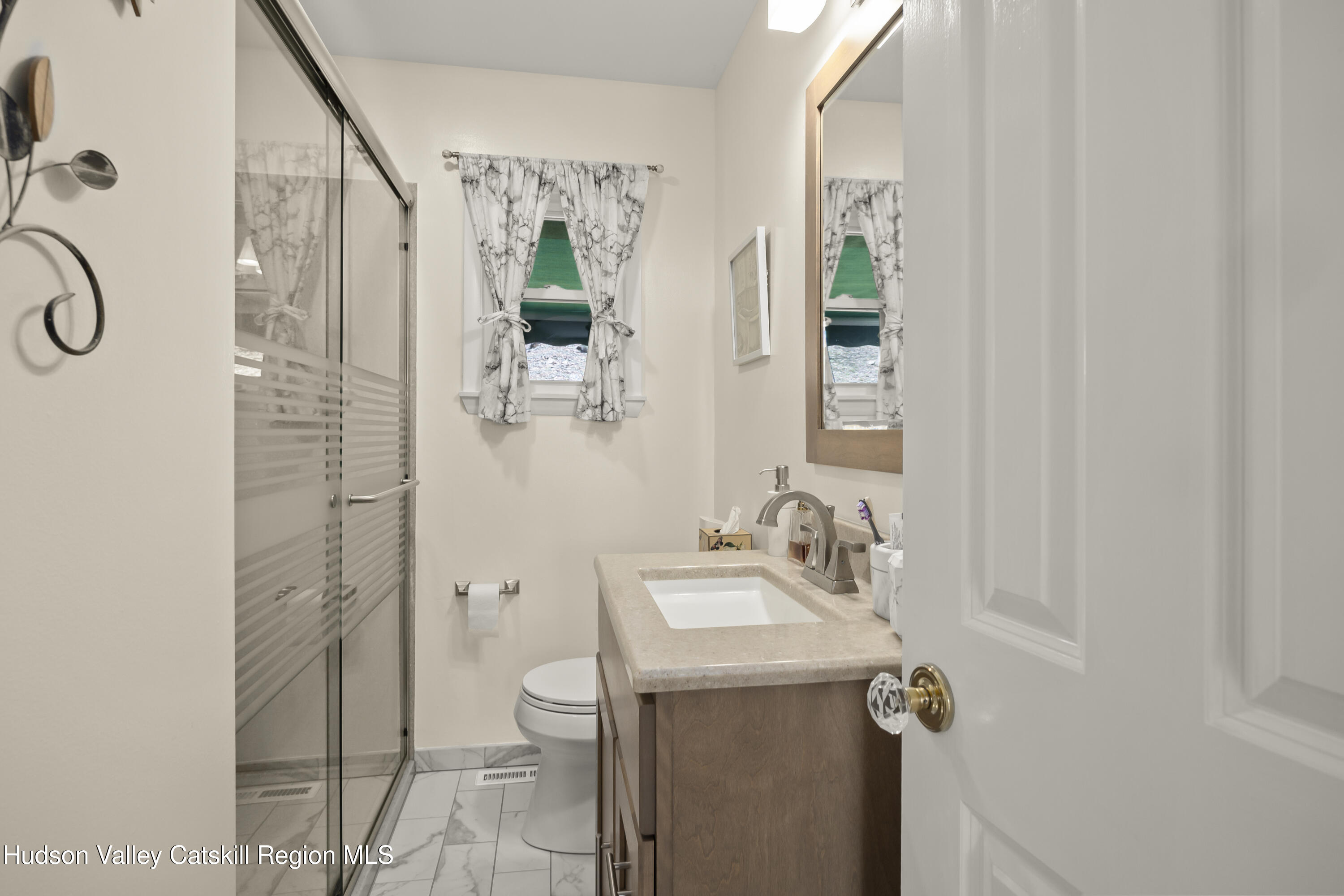 412 Vosenkill Road Athens, NY 12015 - Photo 13 of 43 a bathroom with a sink a toilet and shower