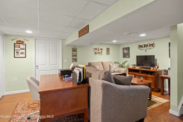 a view of balcony with wooden floor and outdoor seating