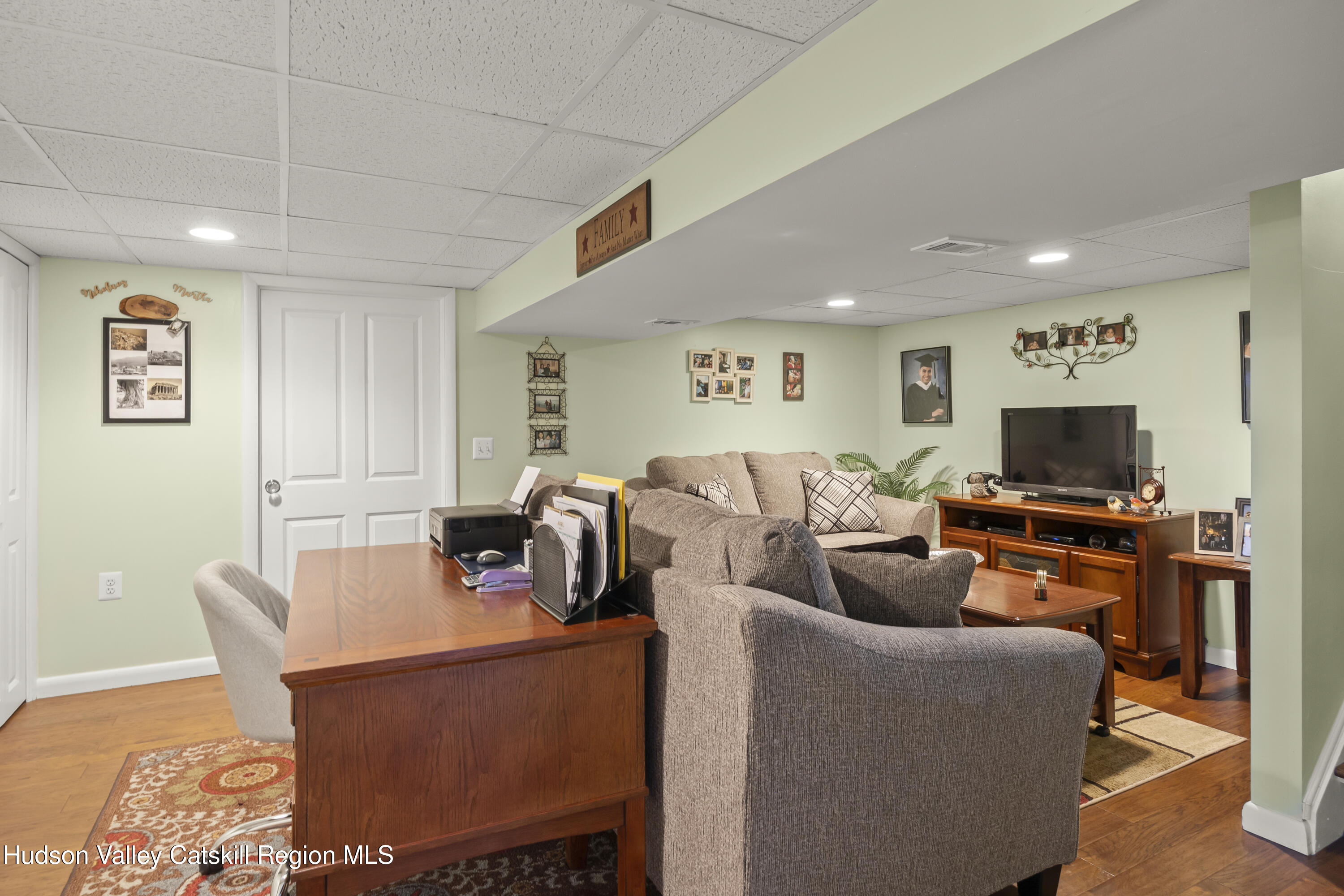 412 Vosenkill Road Athens, NY 12015 - Photo 16 of 43 a living room with furniture and a flat screen tv