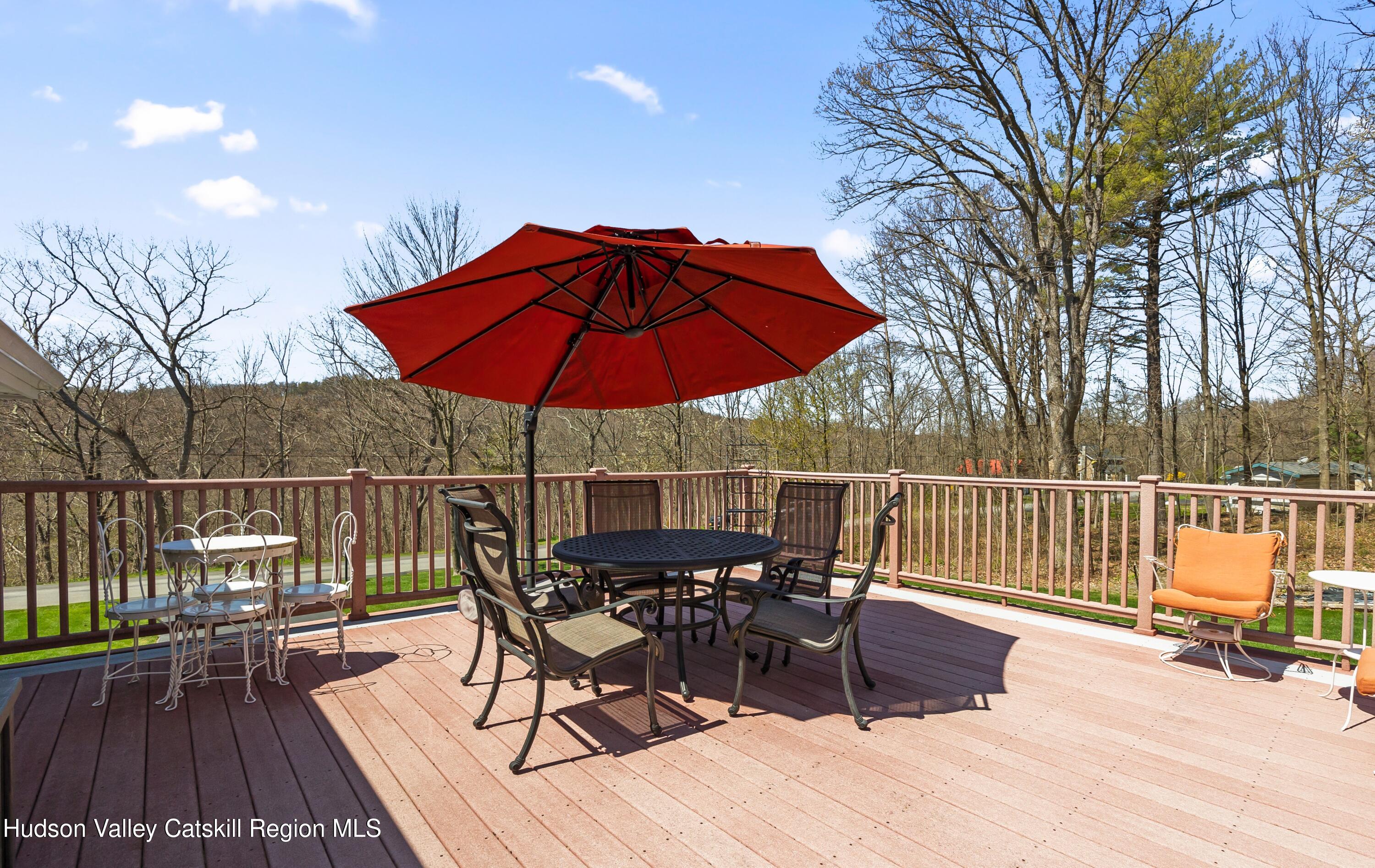 412 Vosenkill Road Athens, NY 12015 - Photo 20 of 43 a view of balcony with wooden floor and outdoor seating