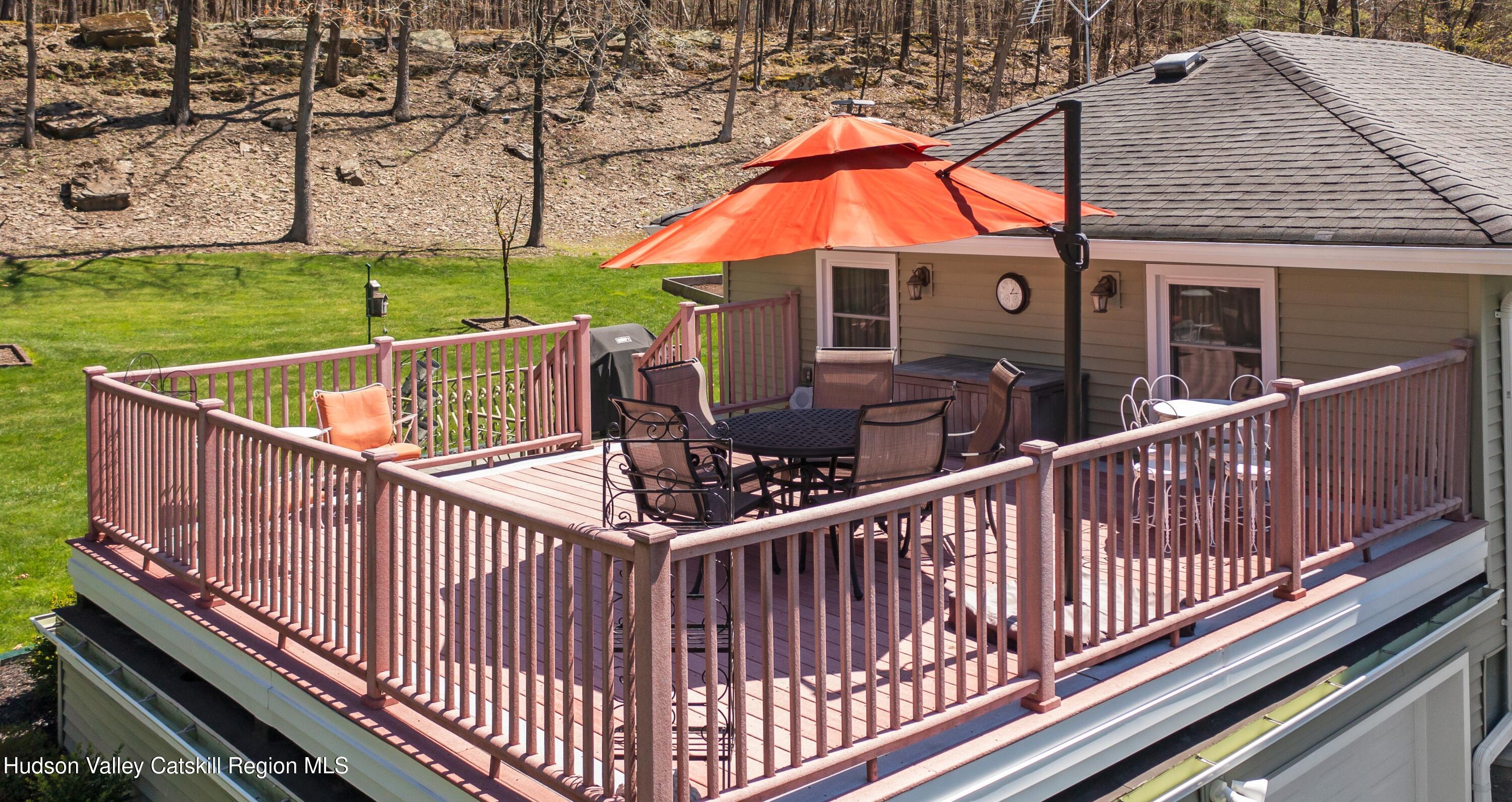 412 Vosenkill Road Athens, NY 12015 - Photo 22 of 43 a view of balcony with wooden floor and outdoor seating