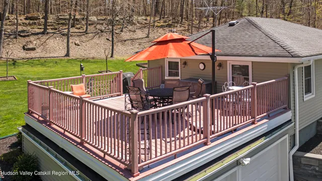 a view of balcony with wooden floor