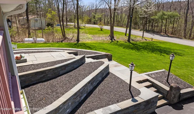 a view of a park with large trees
