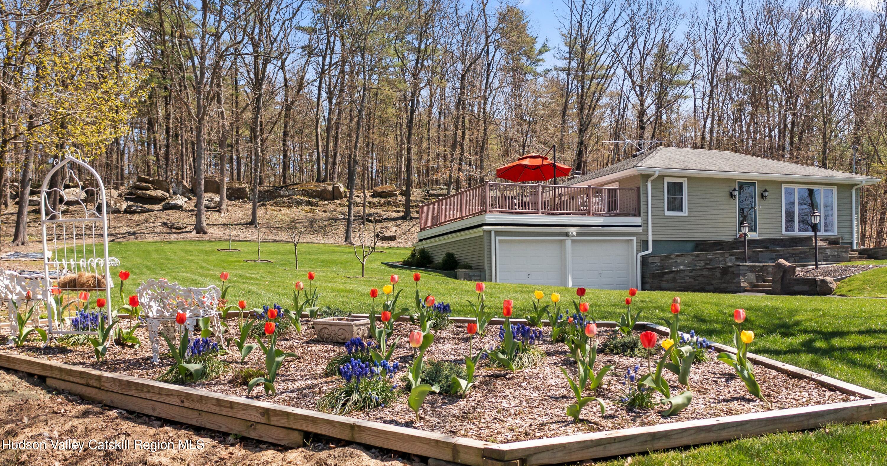 412 Vosenkill Road Athens, NY 12015 - Photo 28 of 43 a view of a chairs and table in a backyard