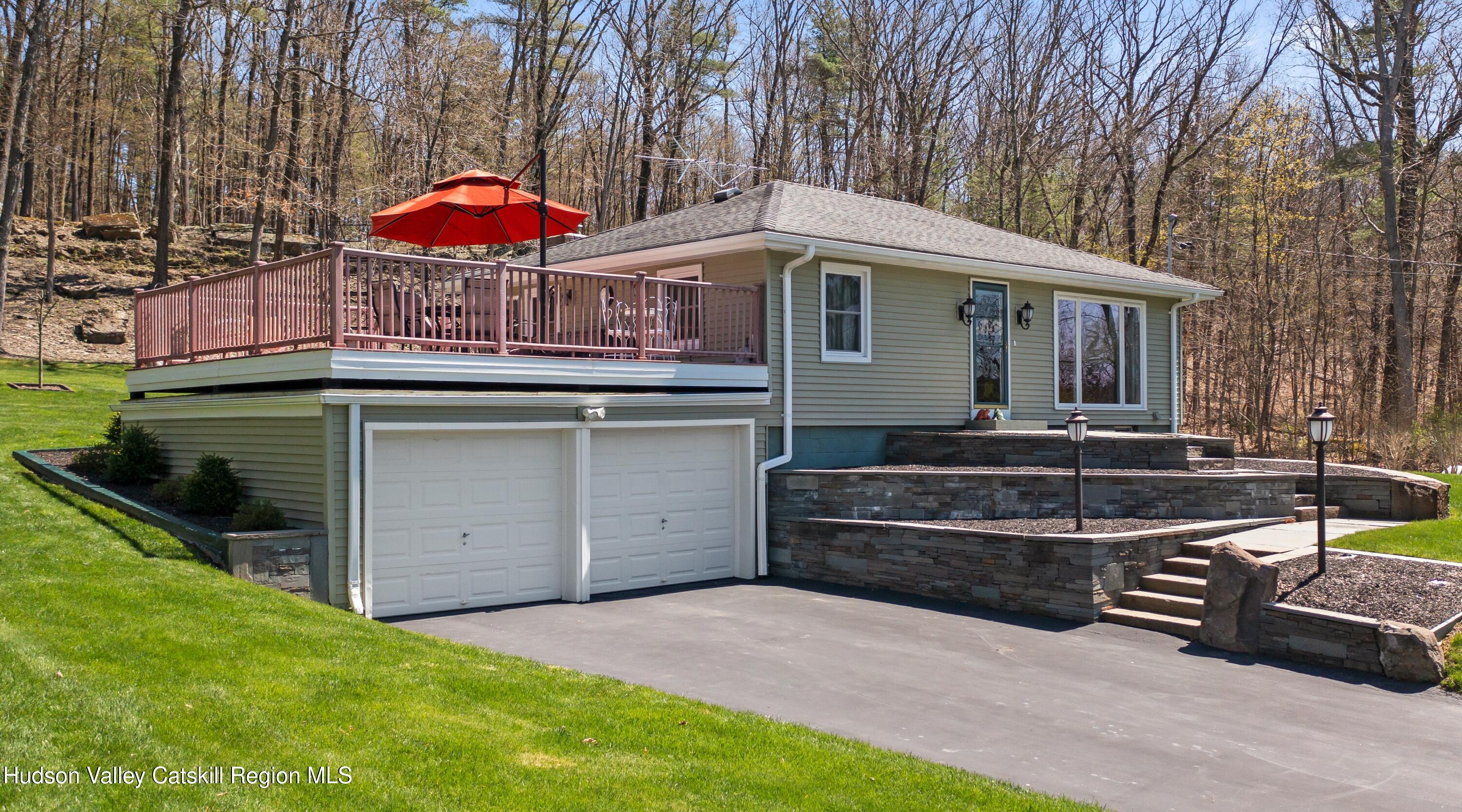 412 Vosenkill Road Athens, NY 12015 - Photo 33 of 43 a view of a house with backyard and sitting area