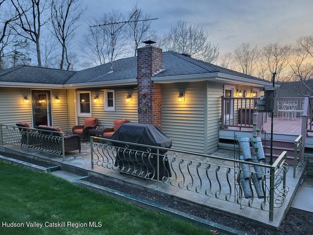 412 Vosenkill Road Athens, NY 12015 - Photo 36 of 43 a view of house with a deck and furniture