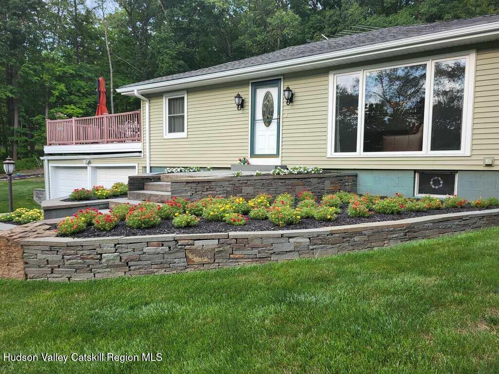 412 Vosenkill Road Athens, NY 12015 - Photo 37 of 43 a front view of a house with a yard