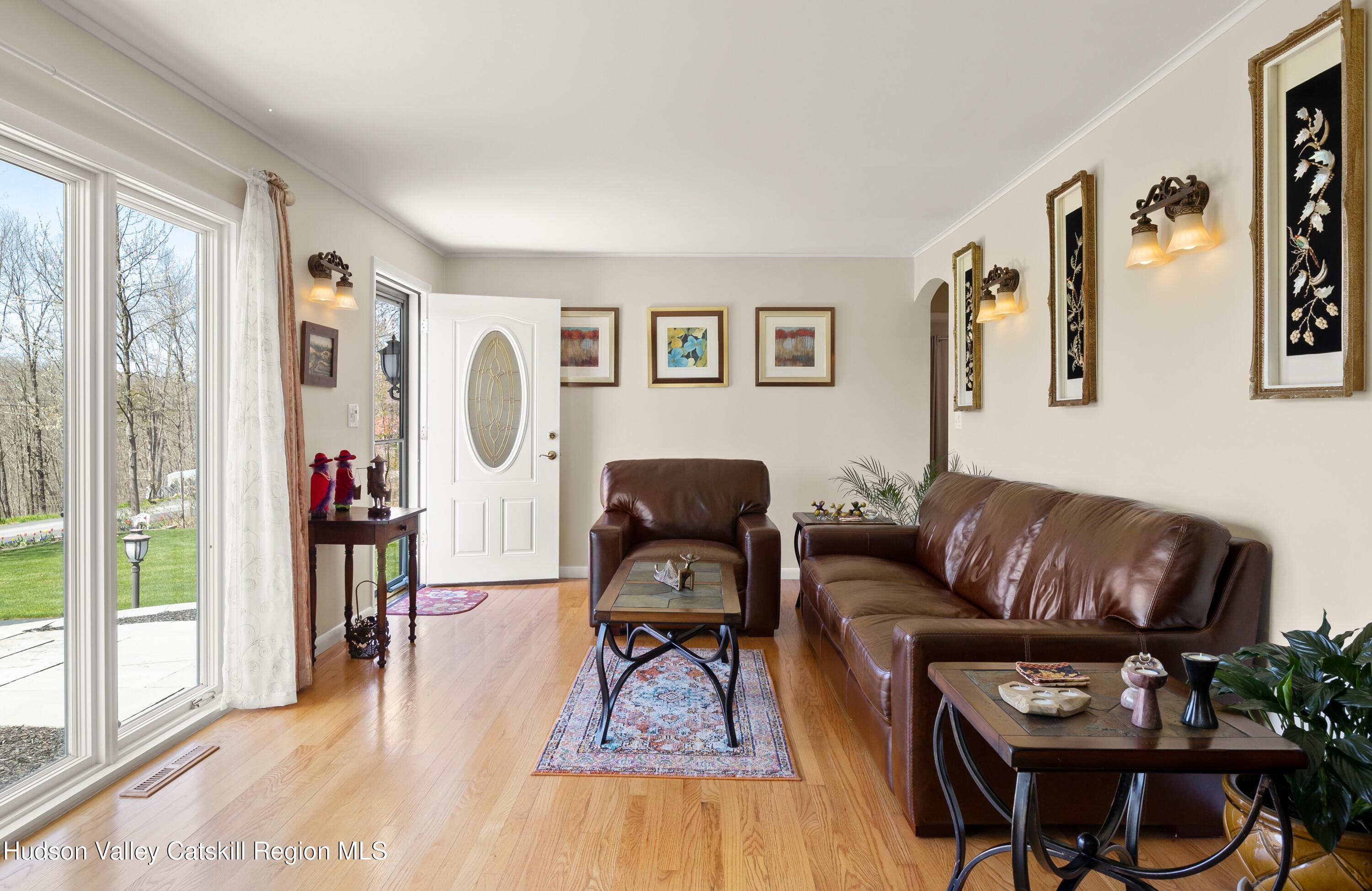 412 Vosenkill Road Athens, NY 12015 - Photo 4 of 43 a living room with furniture and a large window