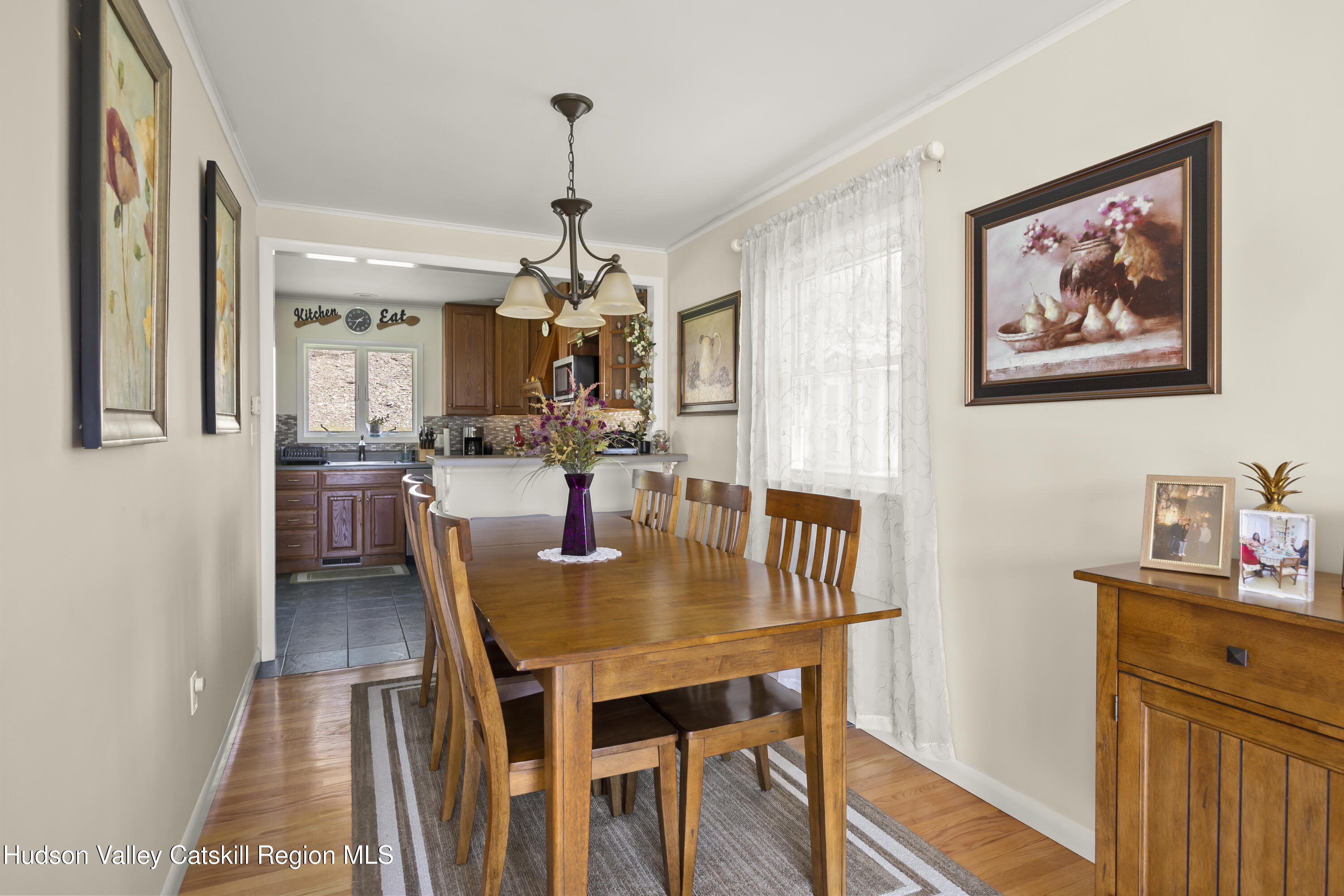 412 Vosenkill Road Athens, NY 12015 - Photo 7 of 43 a view of a dining room with furniture and wooden floor