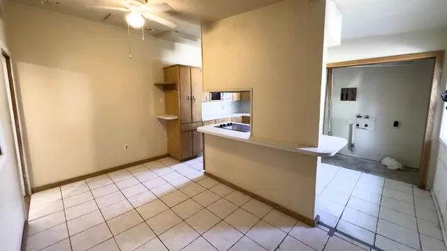 a kitchen with stainless steel appliances a sink and a refrigerator