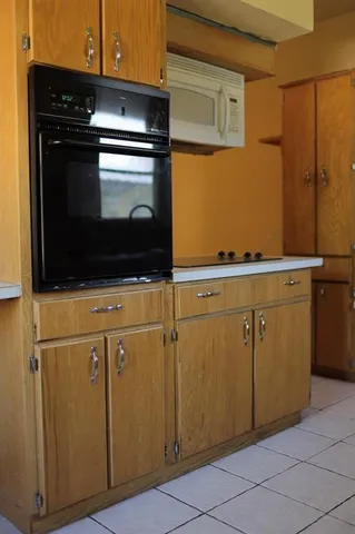 a view of a big room with closet and a ceiling fan