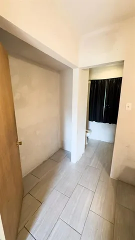 a view of hallway with washer and dryer
