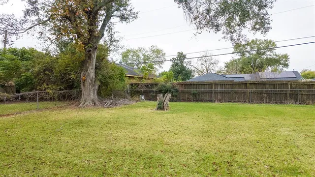 a view of a backyard with sitting area