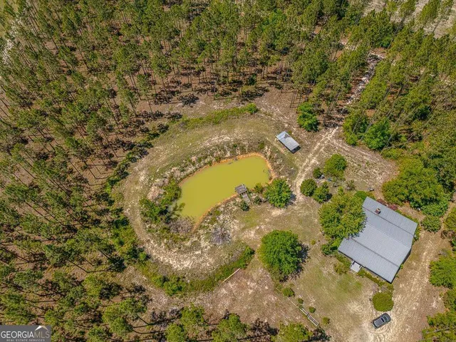 a kitchen with a white cabinets and window