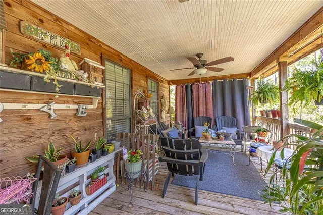 a large kitchen with kitchen island a large counter space dining table and stainless steel appliances