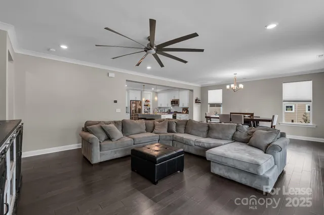 a bathroom with a granite countertop sink and a toilet