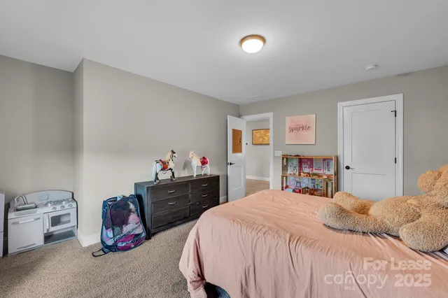 a bathroom with a granite countertop sink toilet and mirror