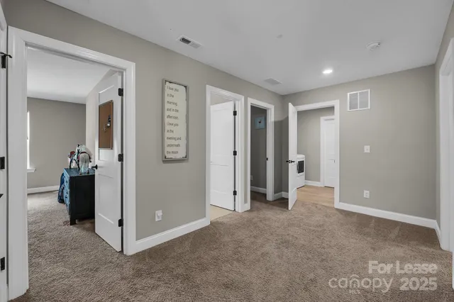 a spacious bedroom with a bed and a couch