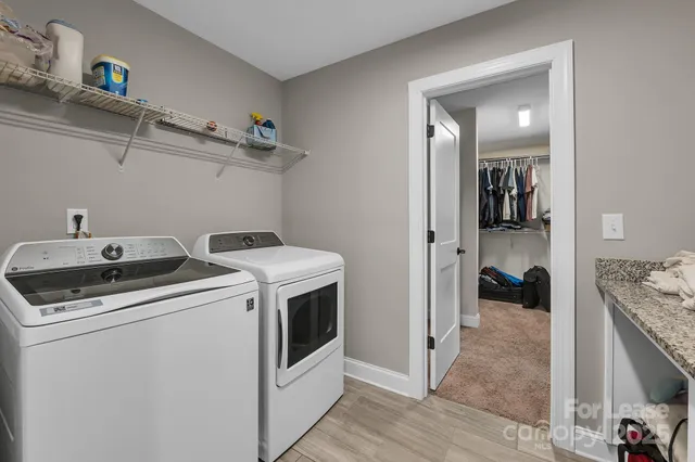 a bathroom with a shower sink and mirror