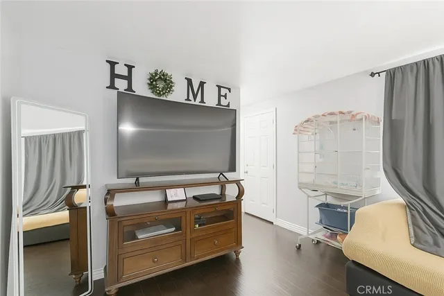 a room with furniture and a flat screen tv