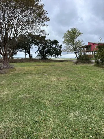 a view of a water fountain and center of the house