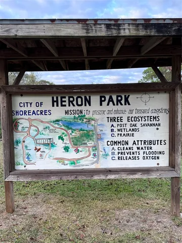 a view of a backyard with large trees
